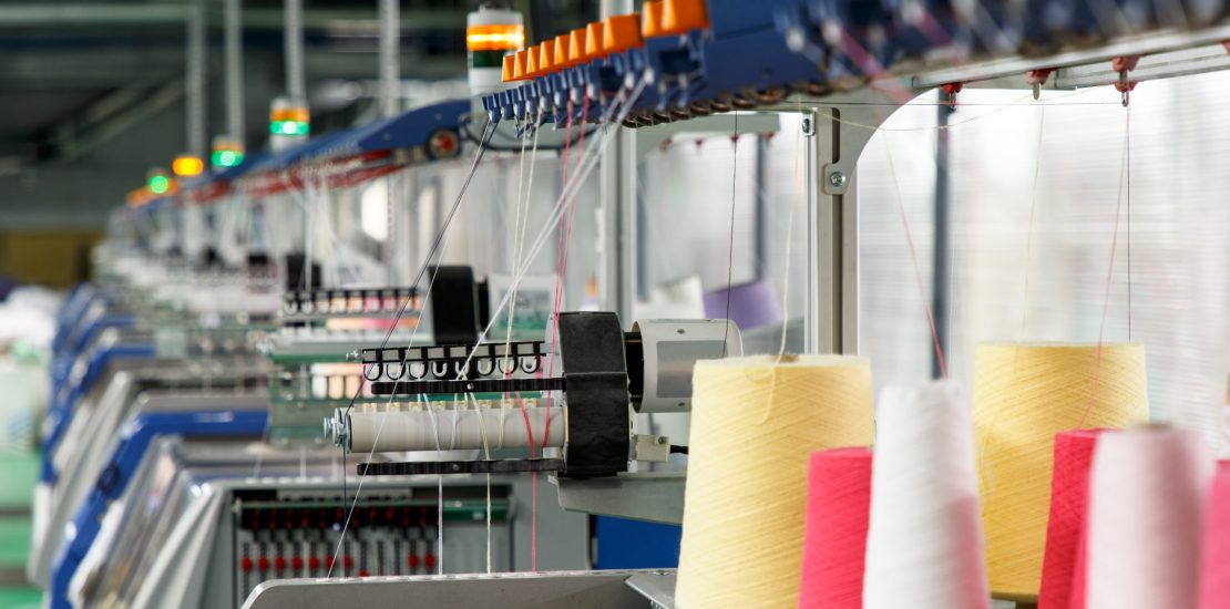 Textile industry with knitting machines in factory