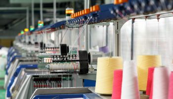 Textile industry with knitting machines in factory